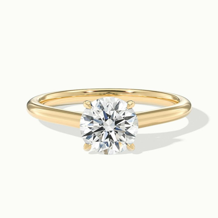 Nia 1.5 Carat Round Cut Solitaire Moissanite Engagement Ring in 10k Yellow Gold