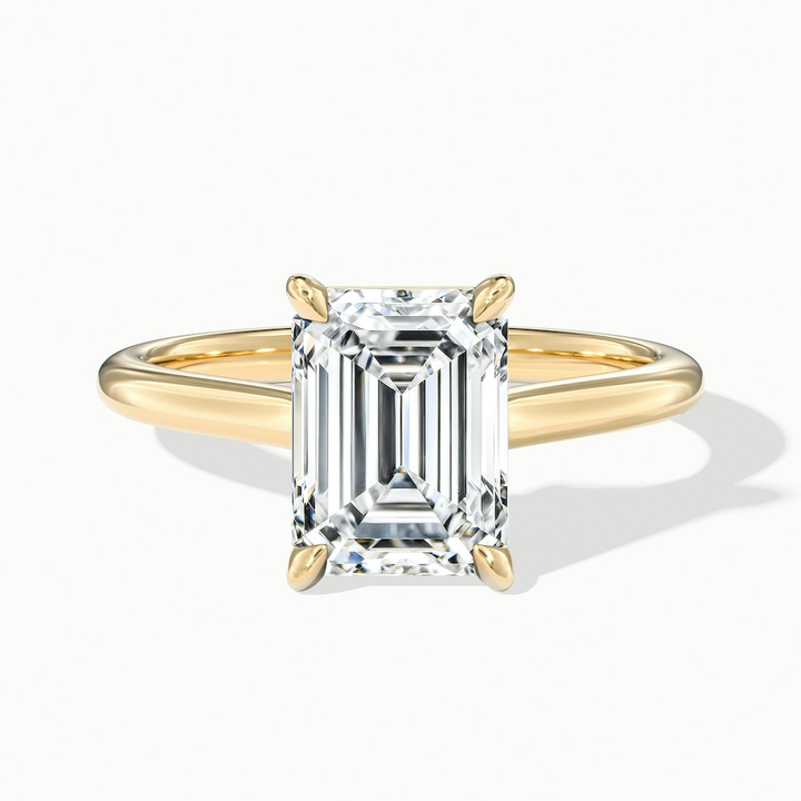 Lea 2 Carat Emerald Cut Solitaire Moissanite Diamond Ring in 10k Yellow Gold