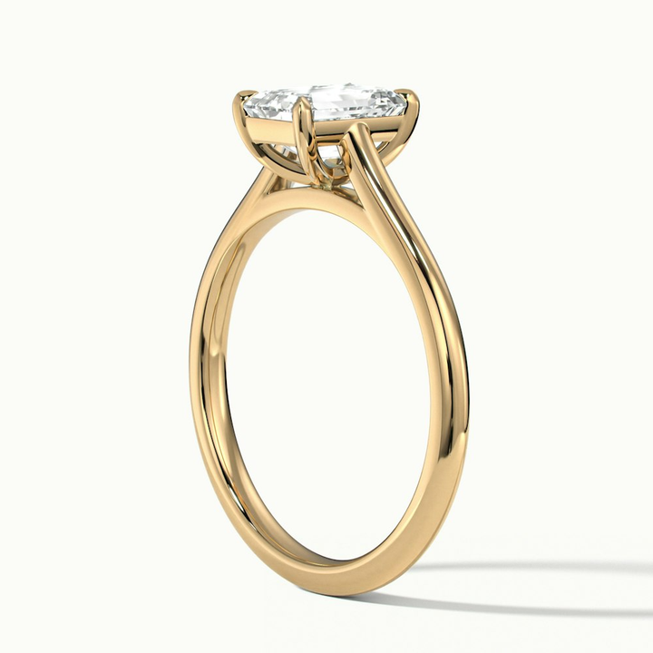 Lea 1.5 Carat Emerald Cut Solitaire Moissanite Diamond Ring in 10k Yellow Gold