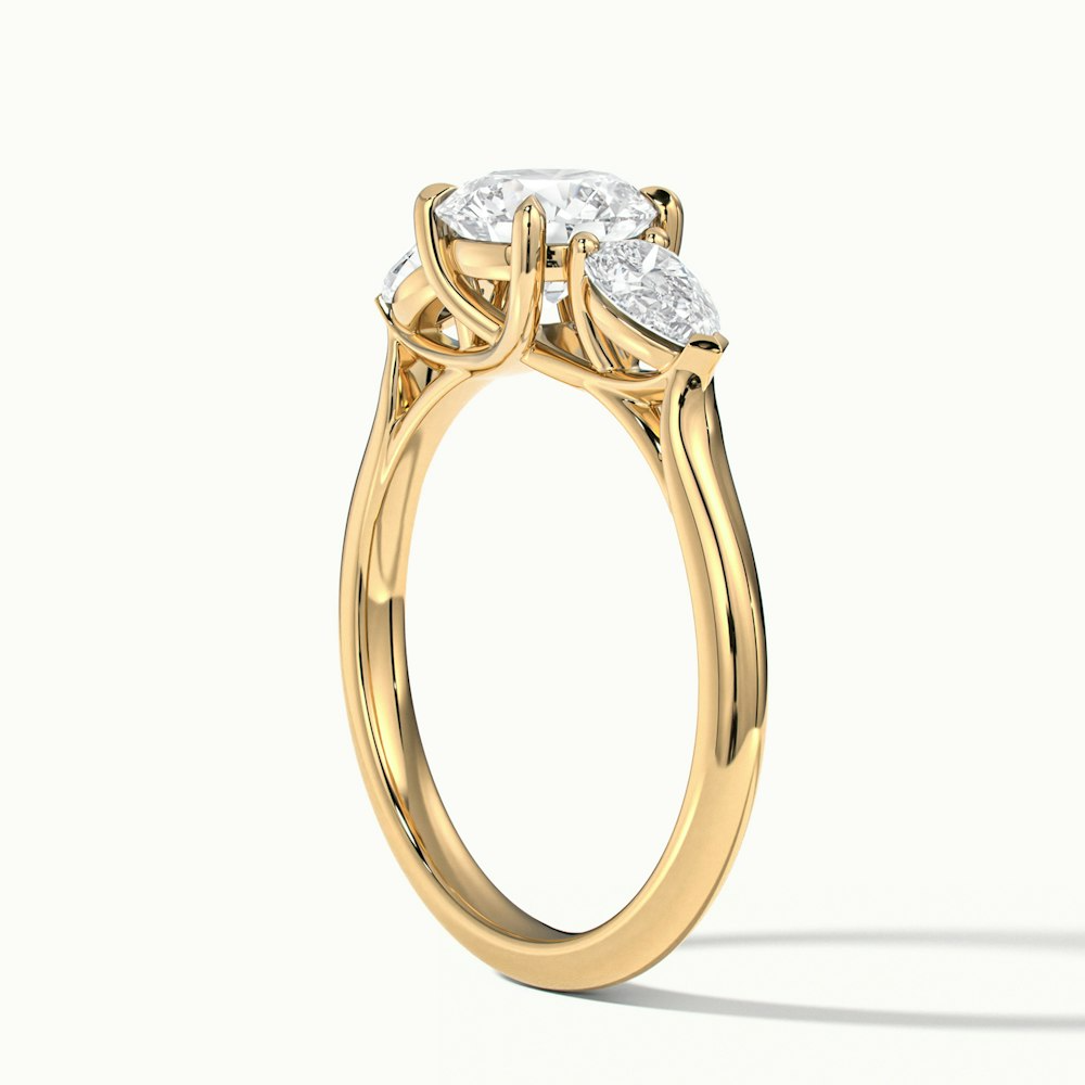 Amaya 3 Carat Round 3 Stone Moissanite Diamond Ring With Pear Side Stone in 10k Yellow Gold